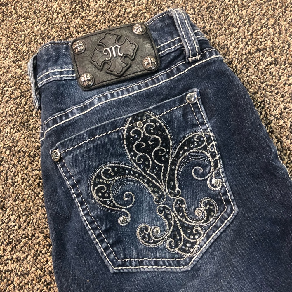 Faded dark blue jeans